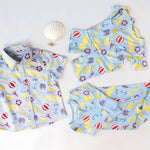 Children's loungewear set, shirt, and zipper romper with beach-themed pattern on a white background