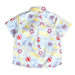 Children's shirt with beach-themed pattern on a white background