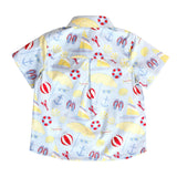 Children's shirt with beach-themed pattern on a white background