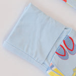 Light blue fabric with colorful flip-flop design on a white background