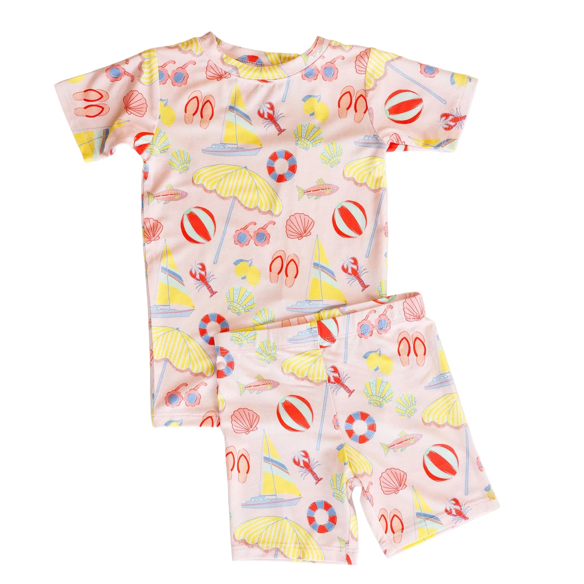 Children's loungewear set with a pink pattern featuring yellow umbrellas, red life buoys, and white clouds on a light beige background.