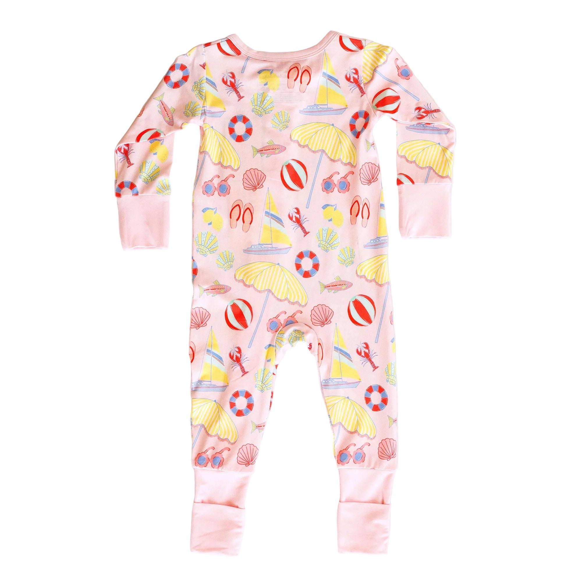 Children's onesie with beach-themed print on a white background