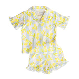 Children's two-piece set with lemon pattern on a white background