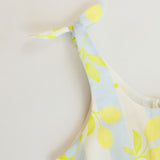 Fabric with lemon pattern on a light blue background