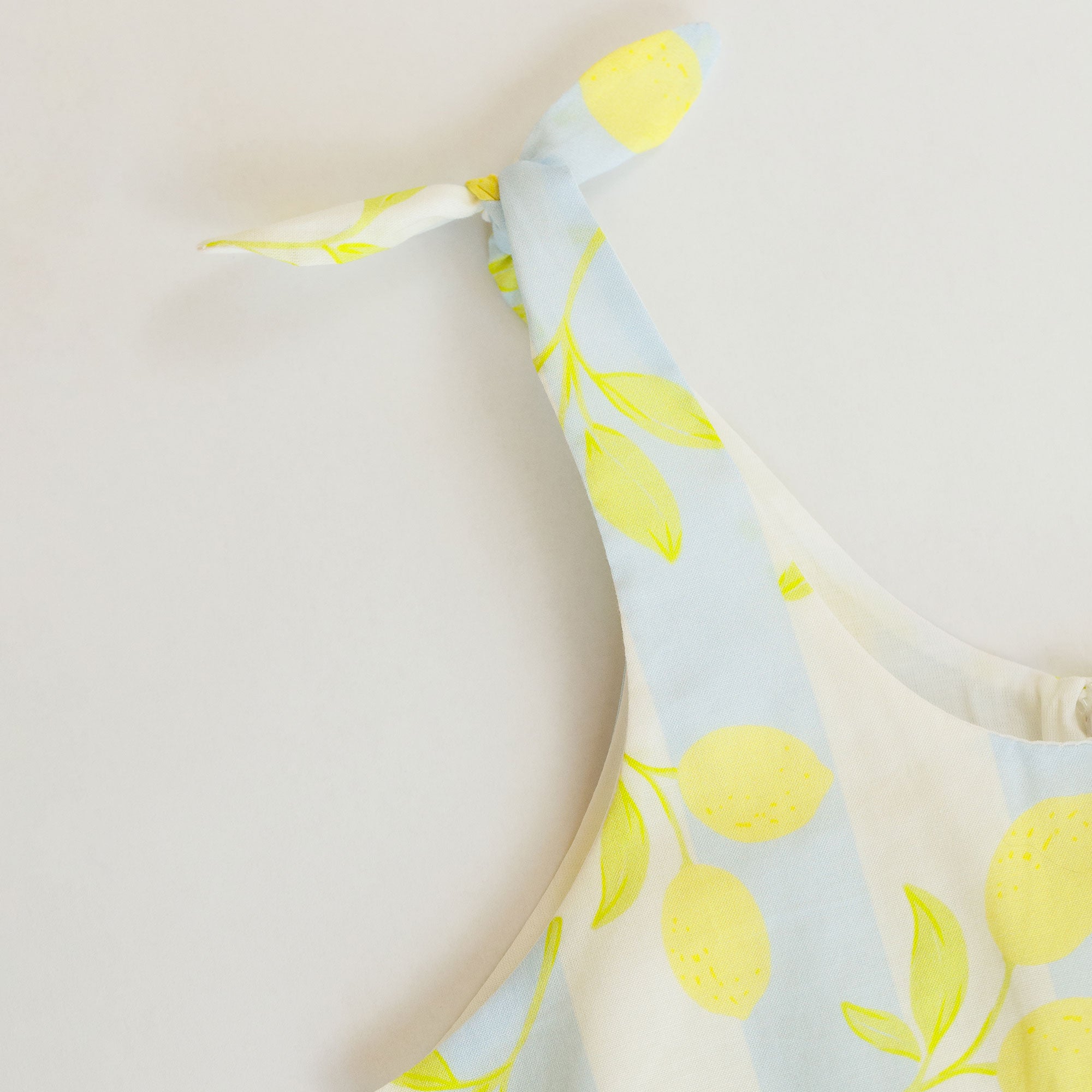 Fabric with lemon pattern on a light blue background