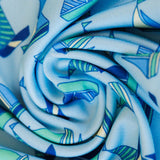 Close-up of a blue and green patterned fabric roll