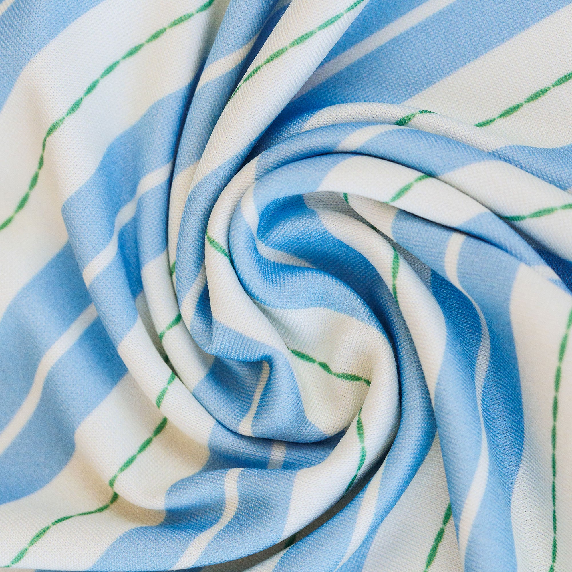 Close-up of blue, white, and green striped fabric